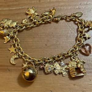 Kirk follyBee honey comb butterflies bears and chime ball sound dangle bracelet.
